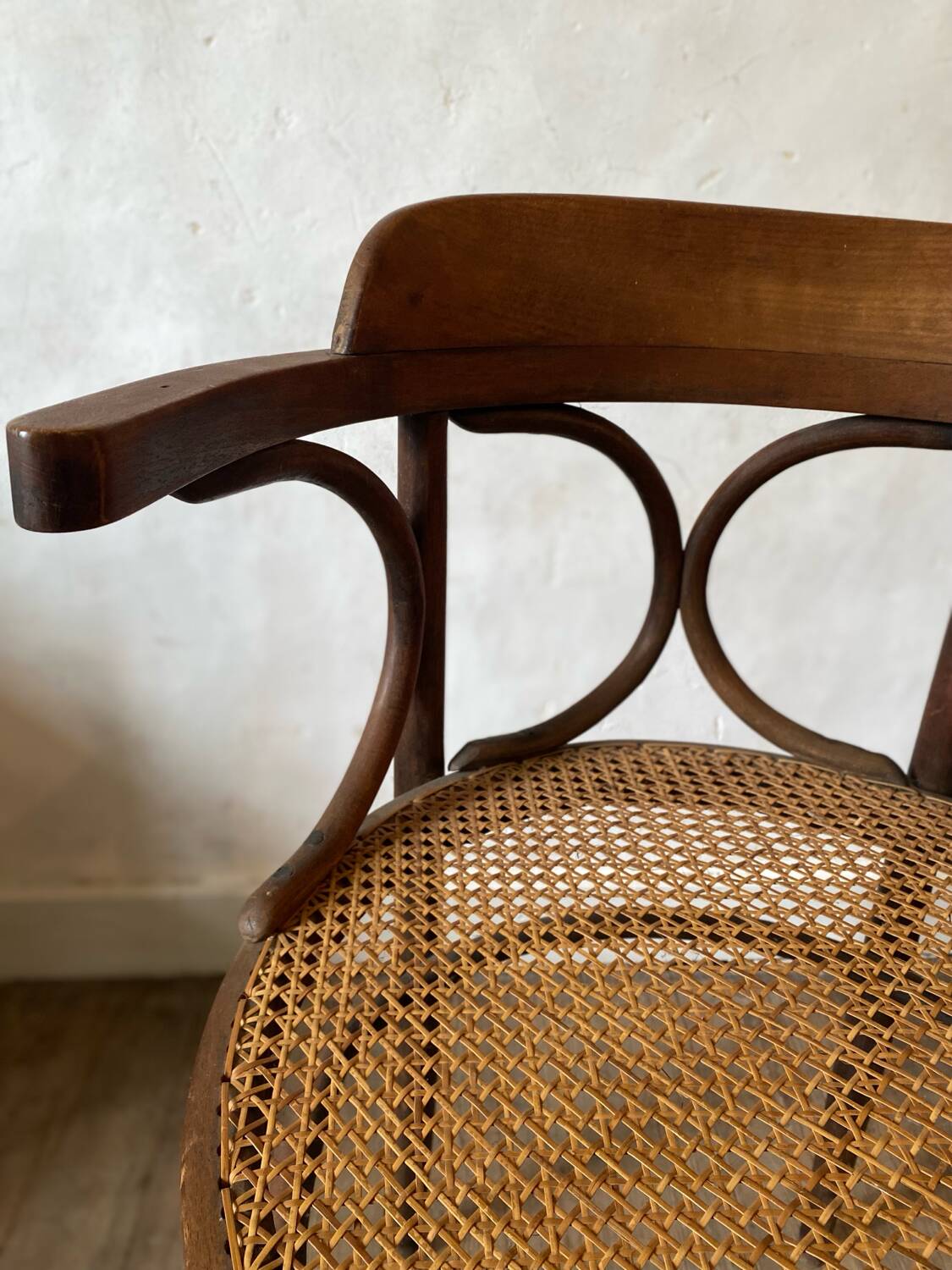 Cane and curved wood armchair