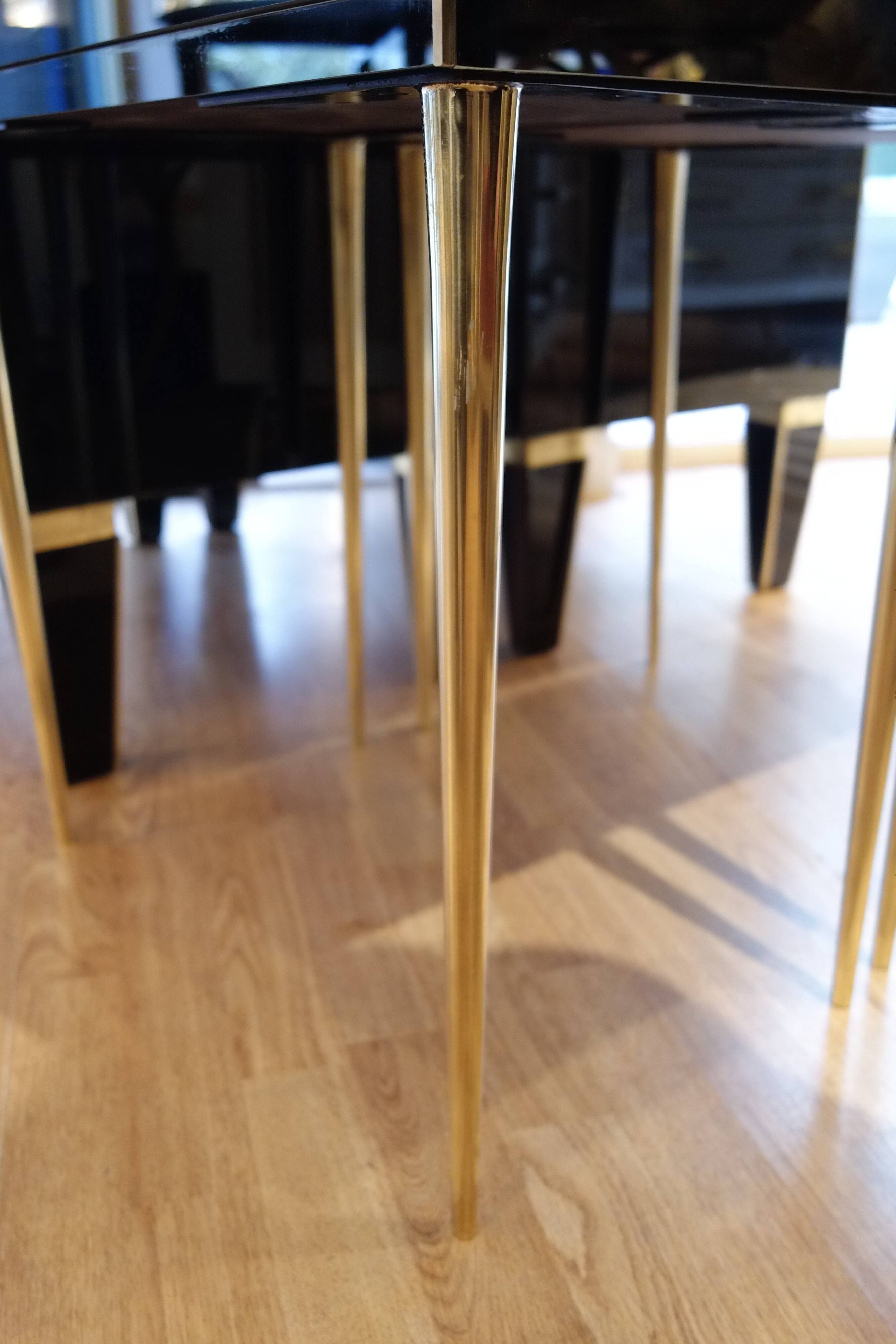 Pair of nightstands in anthracite colored glass and brass