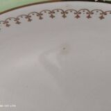 Oval plate with a light green rim and golden frieze, Cafés Lemaire.