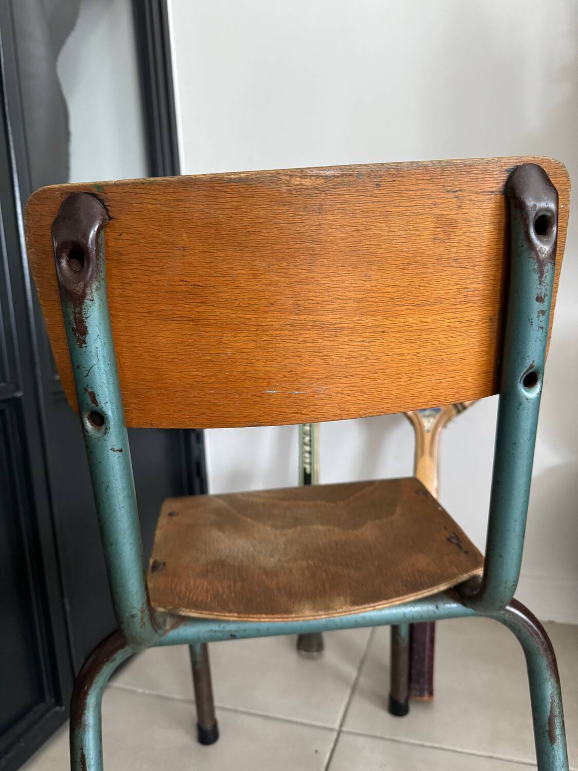 Old wooden and metal children's school chair