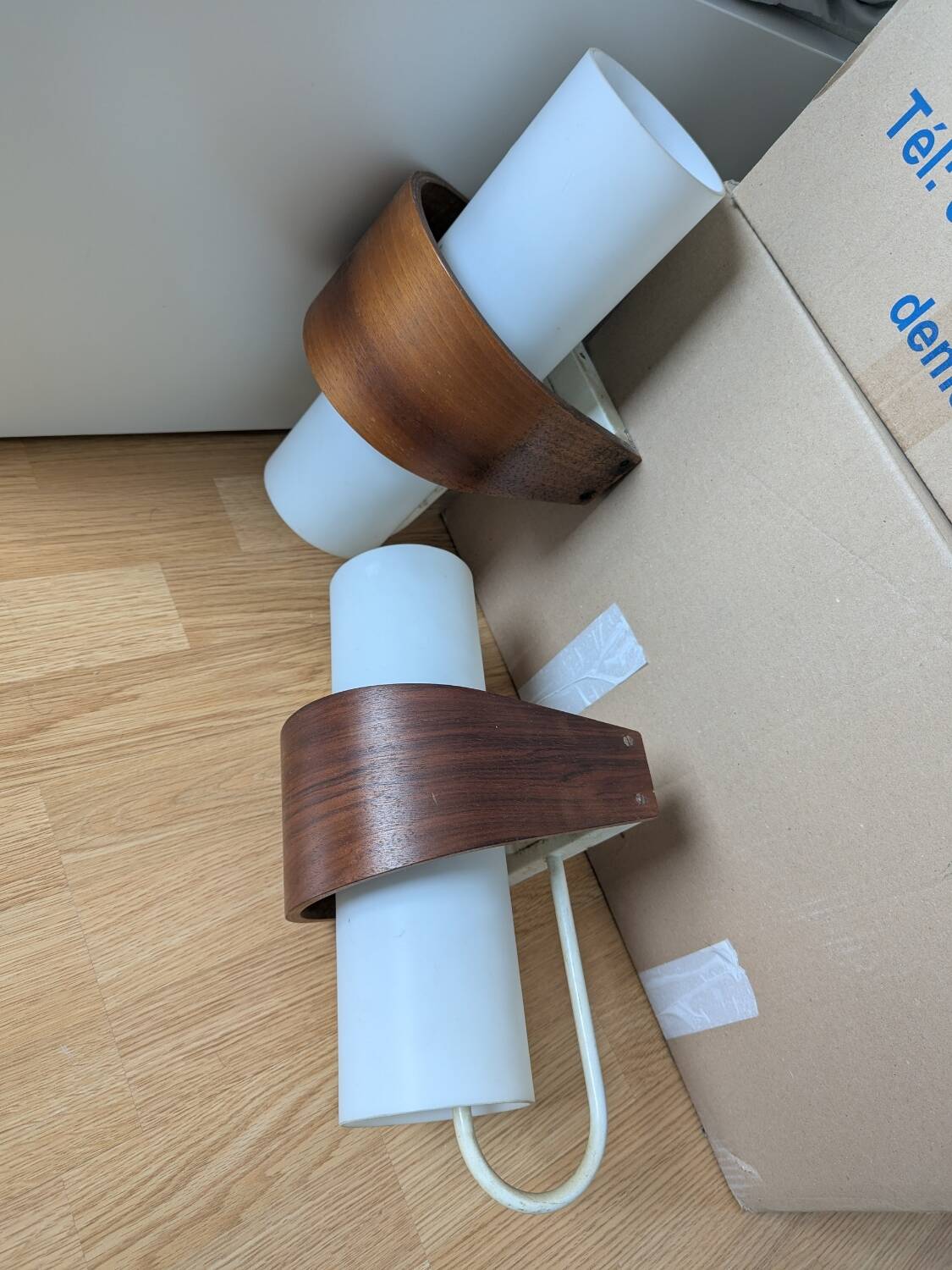 Pair of Louis Kalff NX40 teak and glass wall lights for Philips
