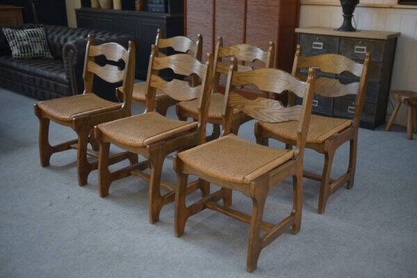 Set of 6 oak dining chairs with rush seat and 'Echelle' backrest in the style of Guillerme et Chambron 1950s