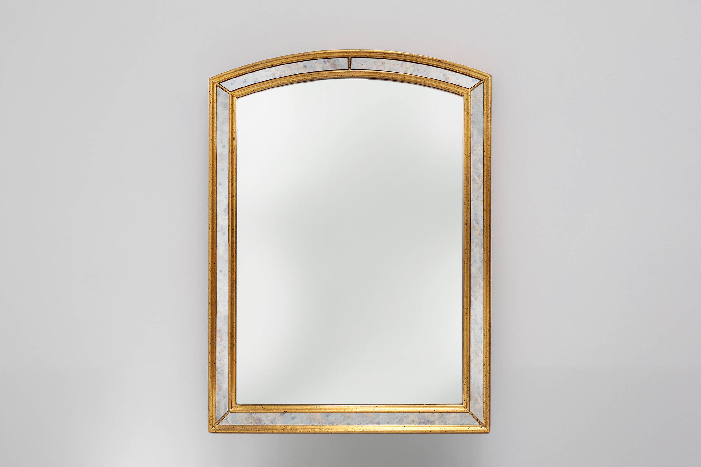 Mirror by Deknudt with marbled fume glass side panels in gilded wooden fram