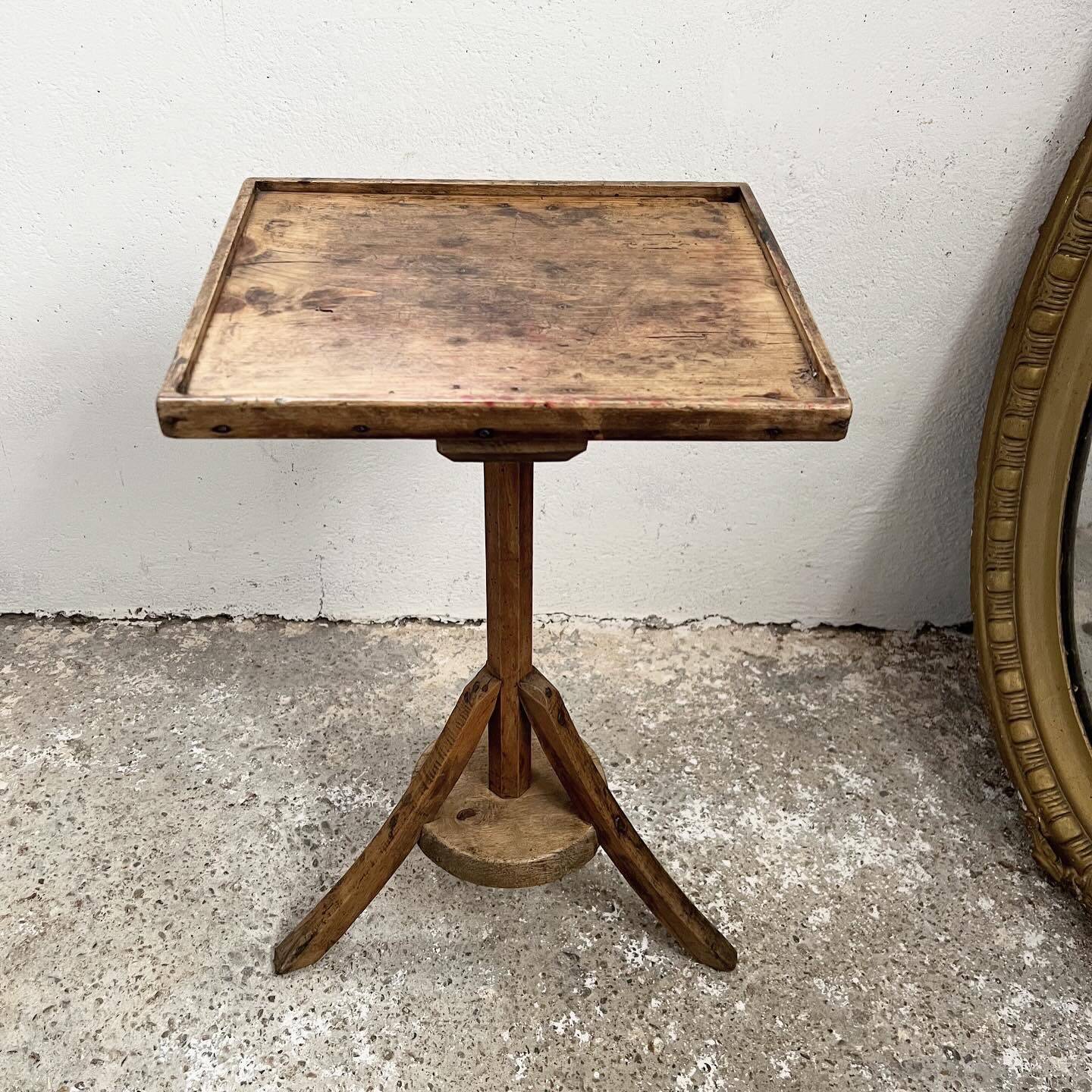 Old primitive wooden tripod pedestal table