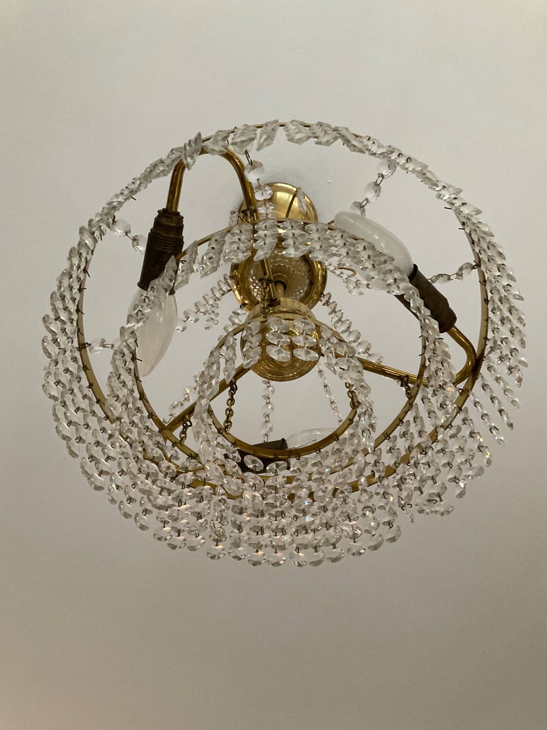 Cascade chandelier with crystal and brass tassels