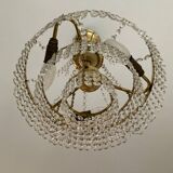 Cascade chandelier with crystal and brass tassels