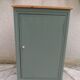 Vintage jam jar enhanced in smoky green, wooden tray.
