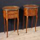 Pair of oval bedside tables in marquetry from the 20th century.