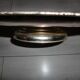Large silver metal tray raised by a central foot