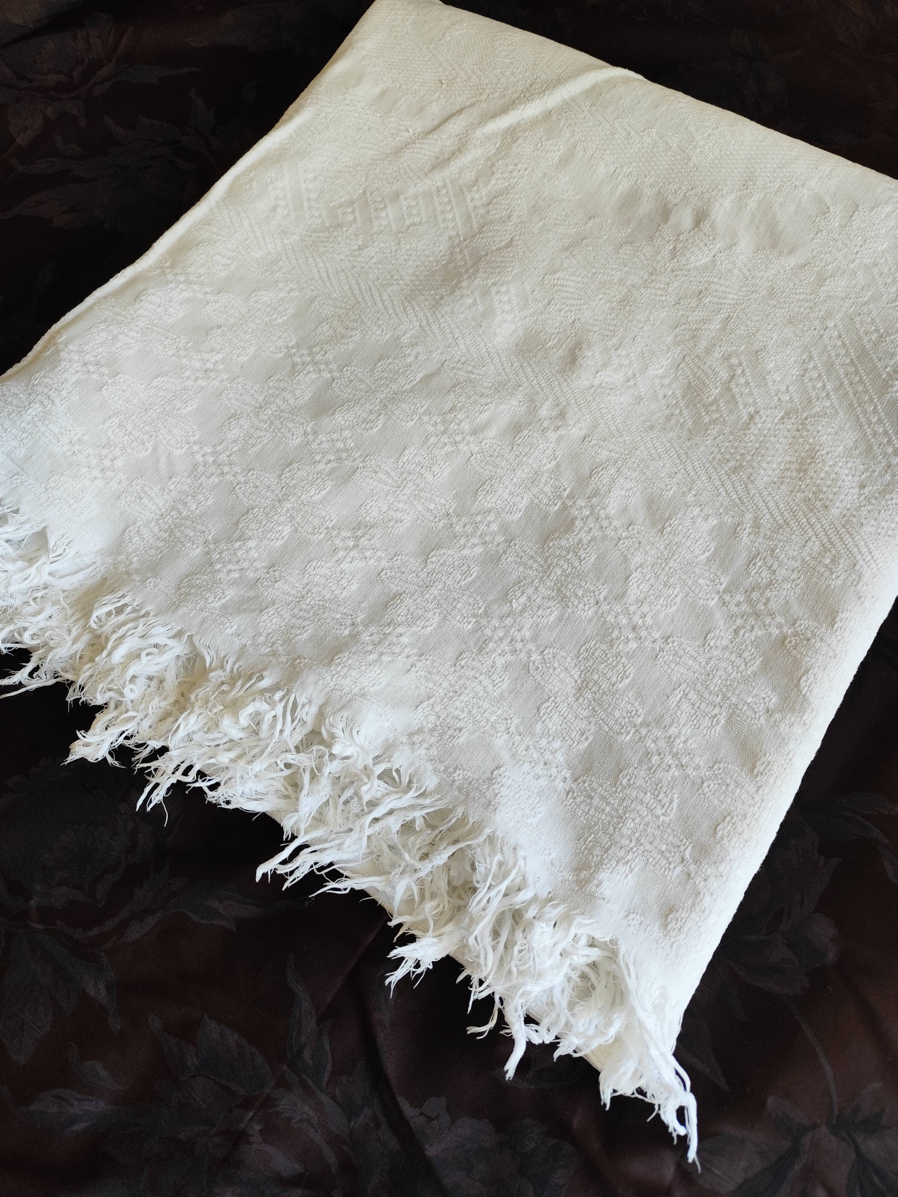 White woven cotton bedspread with fringes
