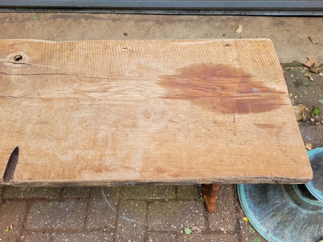 French country style cast iron garden bench with old barn wood plank