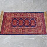 Tapis d’Orient bleu rouge avec franges