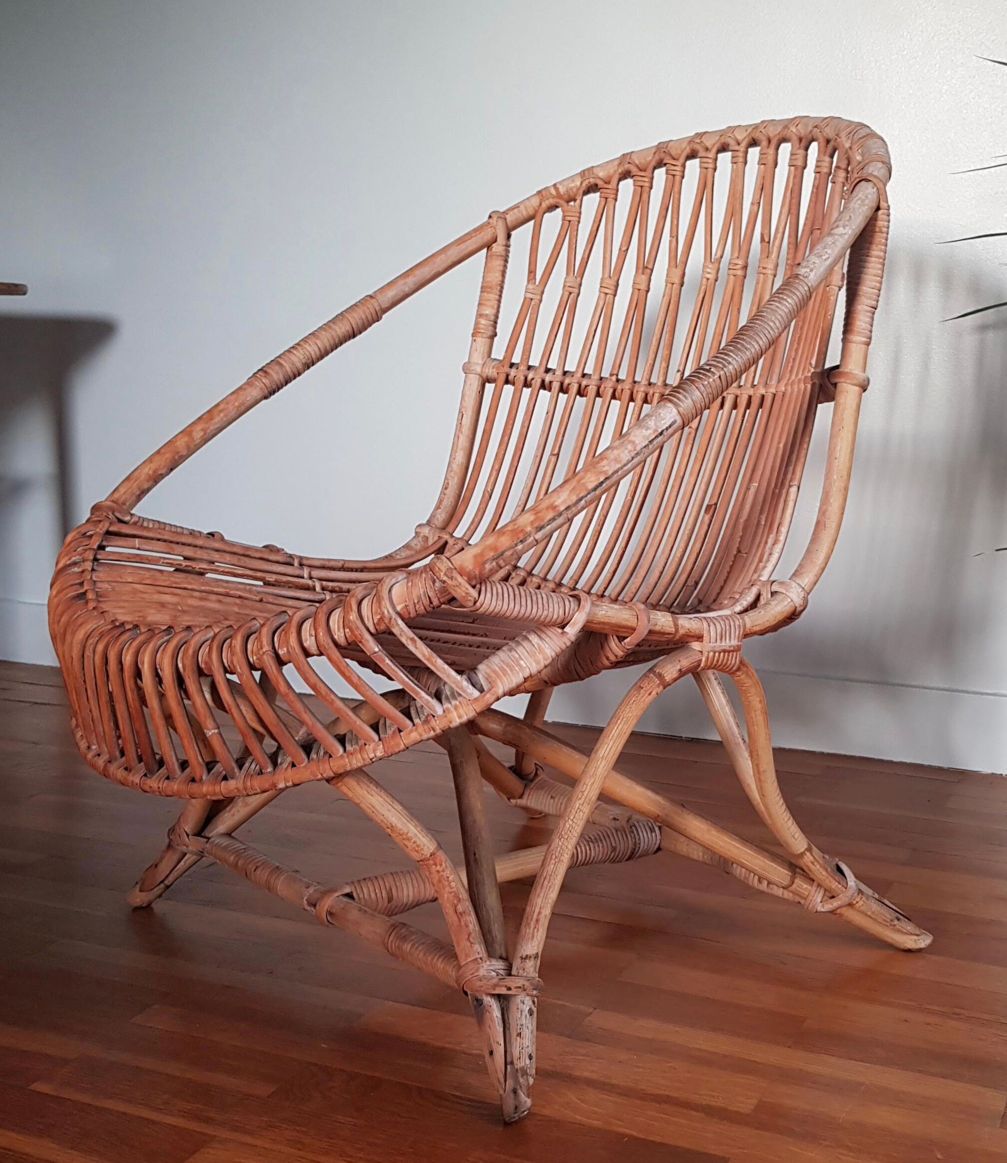 Vintage rattan armchair original shell shape