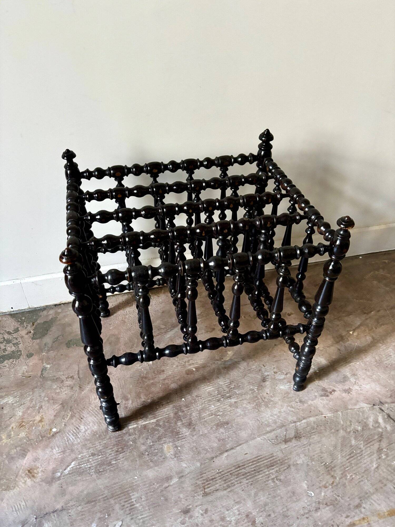Napoleon III magazine rack in black turned wood