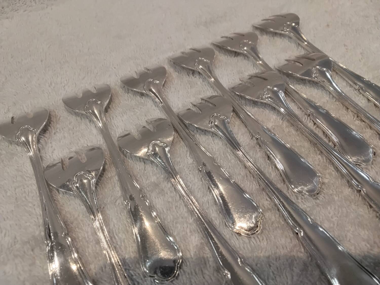 11 silver-plated oyster forks by Orbrille, 13.2cm