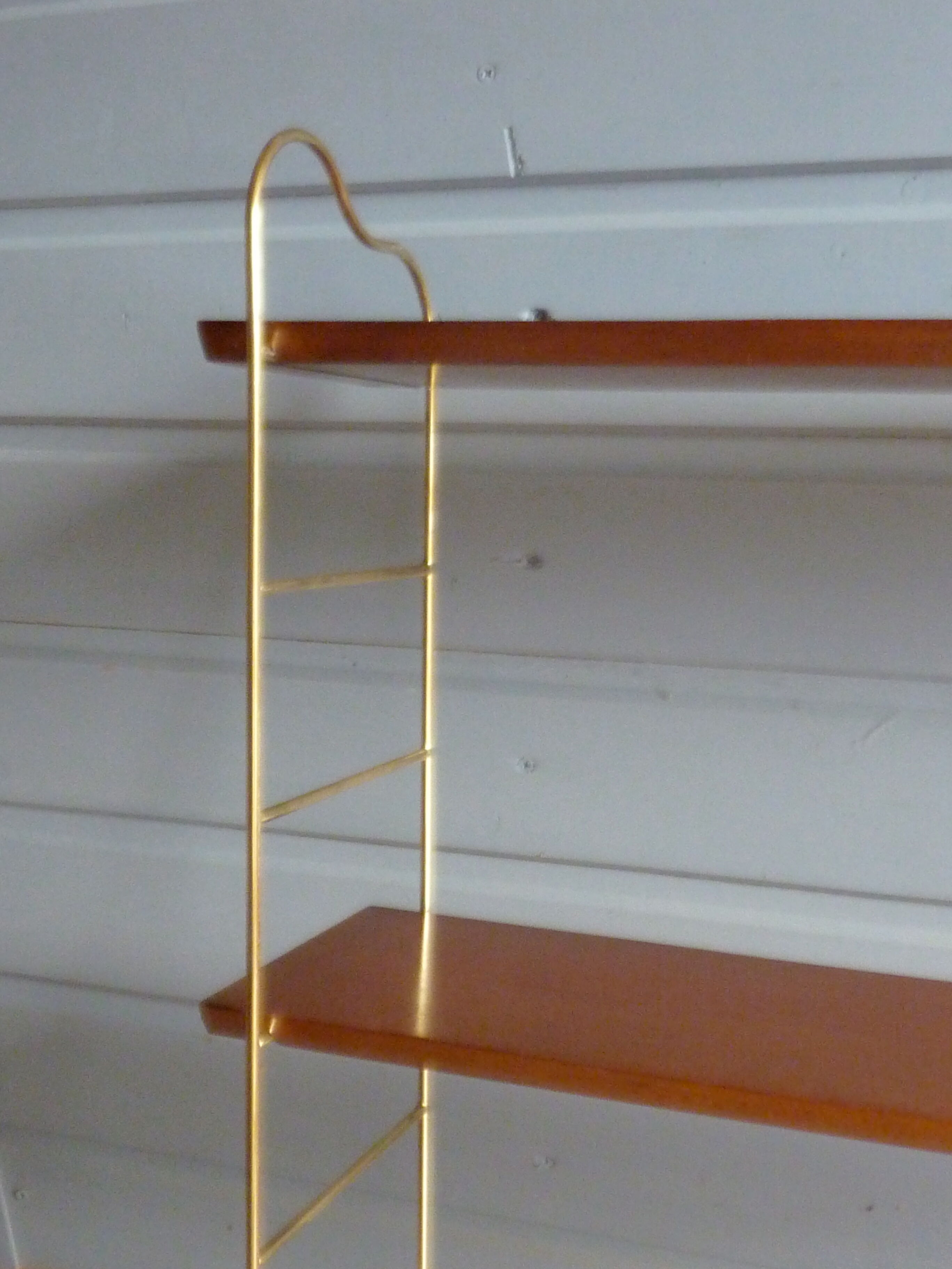 Wall shelves in brass and teak of the 1960s