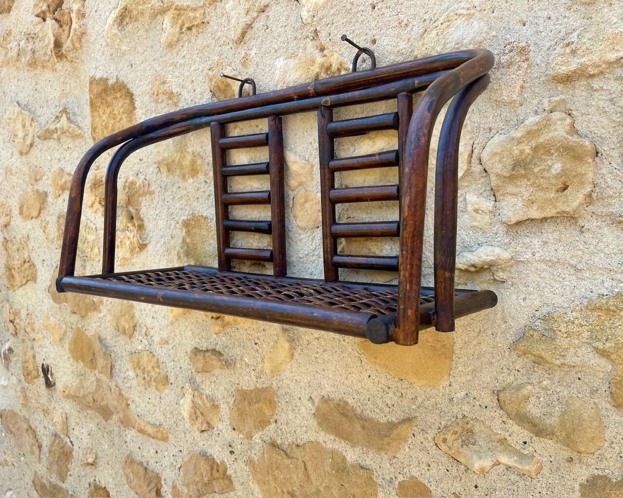 Vintage wall shelf in bamboo and rattan, circa 1960s.