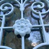 Entrance door in solid oak, cast iron grille, 1930s