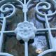 Entrance door in solid oak, cast iron grille, 1930s