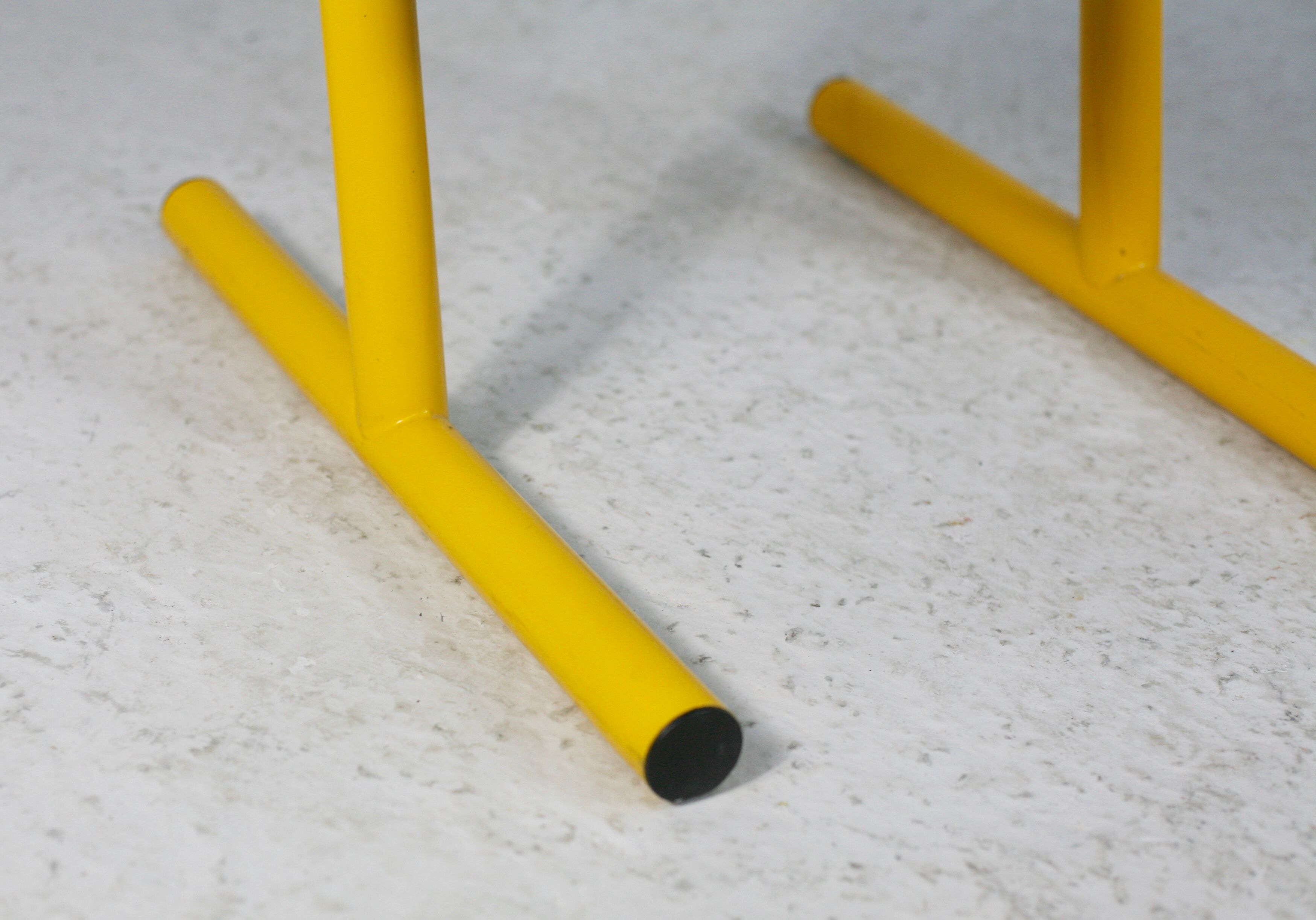 Adjustable seat chair. Circa 1980. Italy. Yellow lacquered steel.