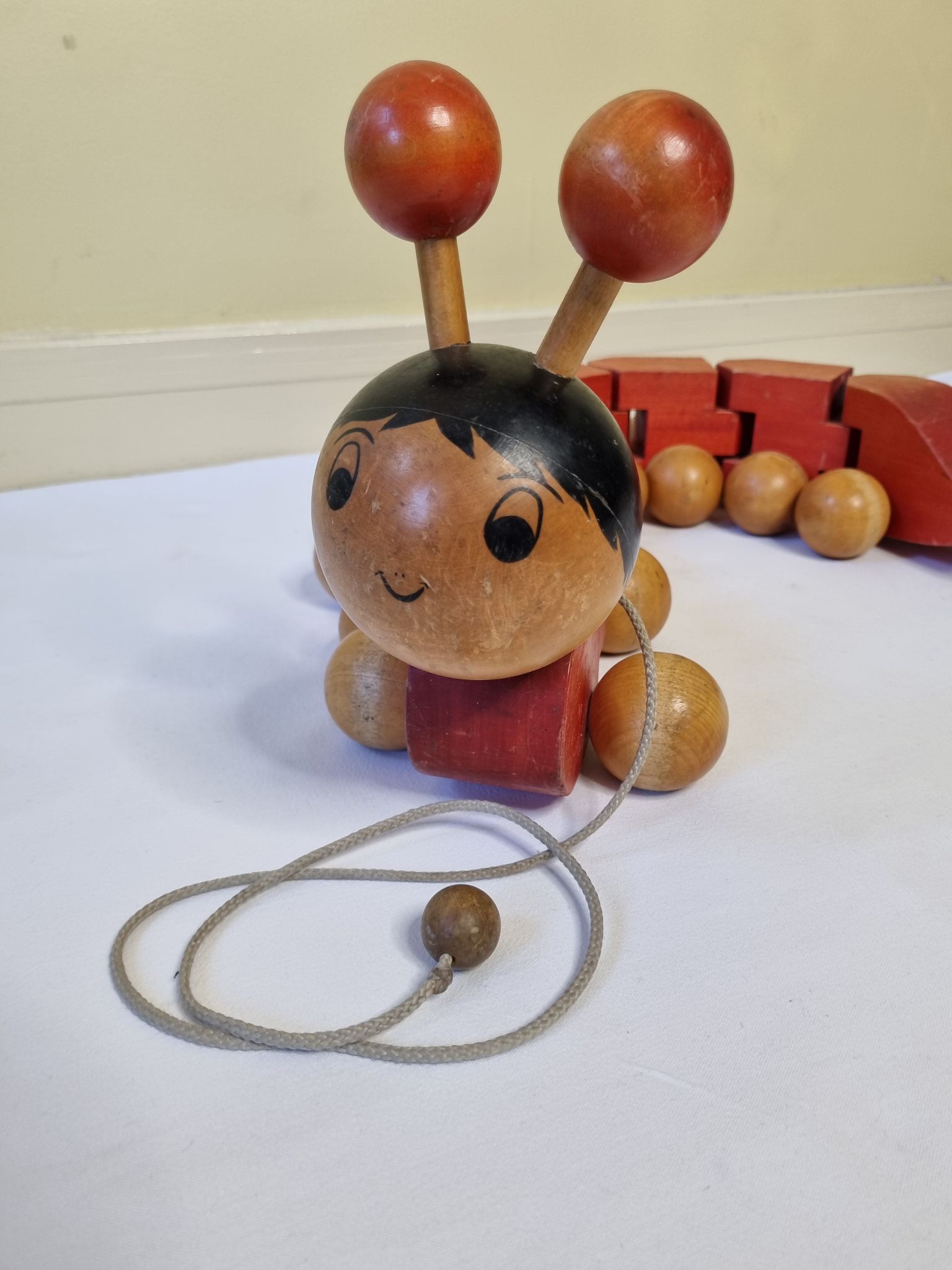 Vintage pulling toy, "centipede", 82 cm, made in Switzerland