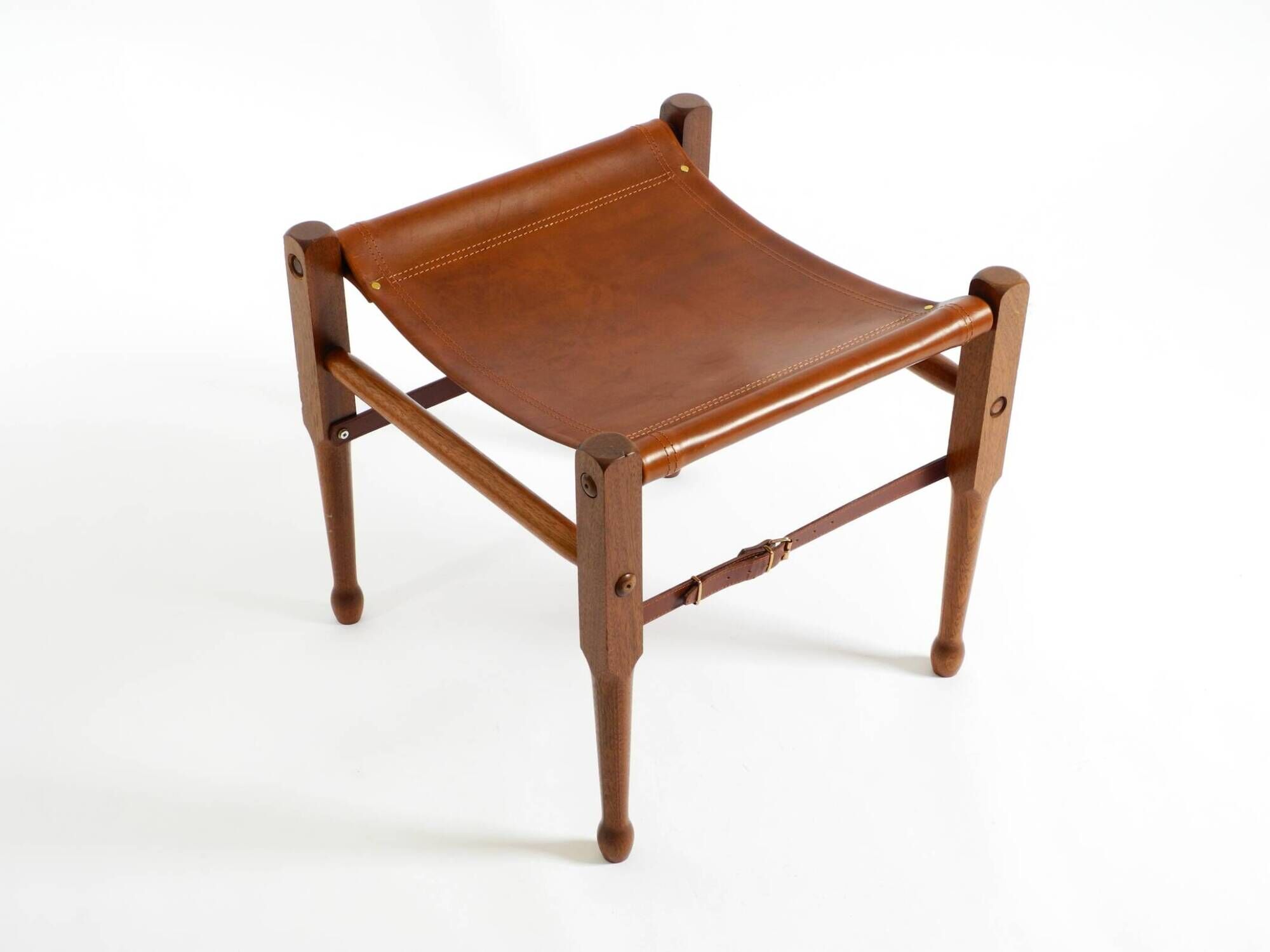 Rare 1990s safari stool with a teak frame and a seat made of brown saddle l