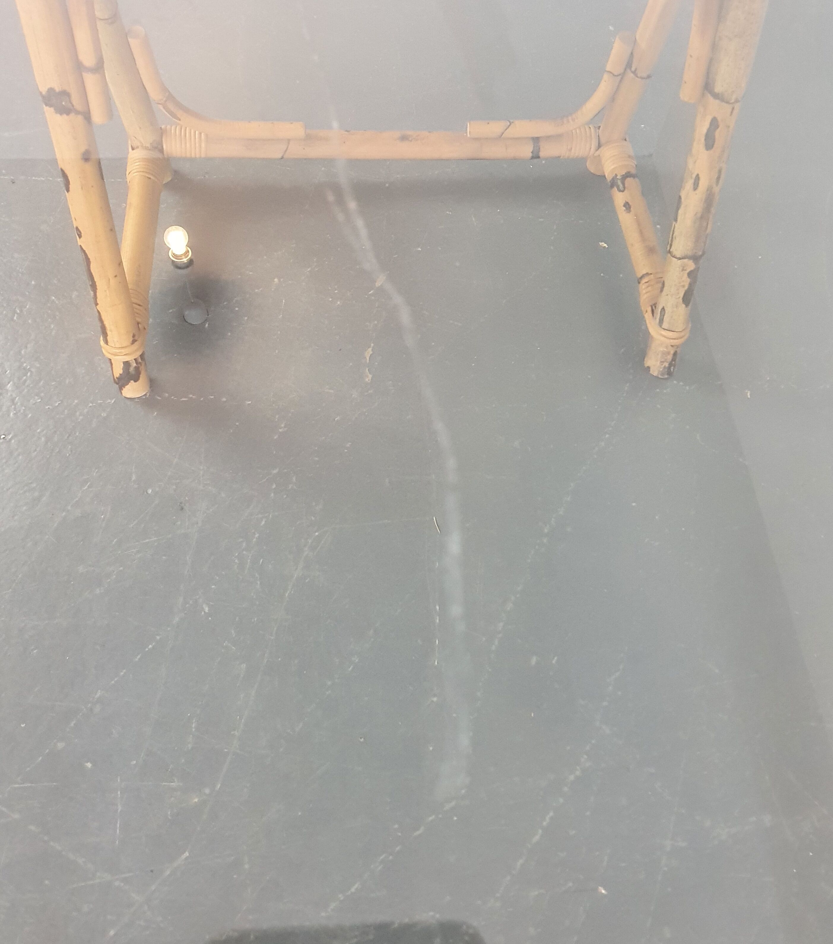 1970s dining table with bamboo trestle legs and smoked glass