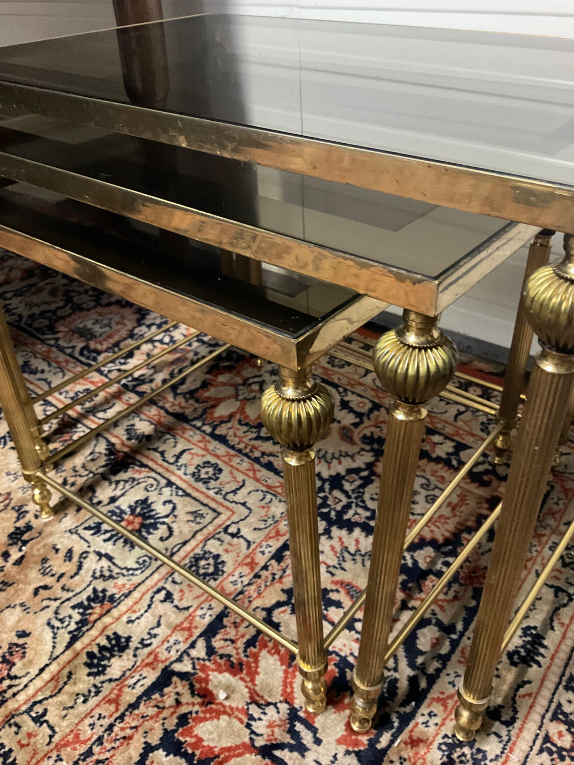 Series of 3 empire style nesting tables in brass and glass