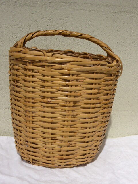 Basket has handles, braided vintage