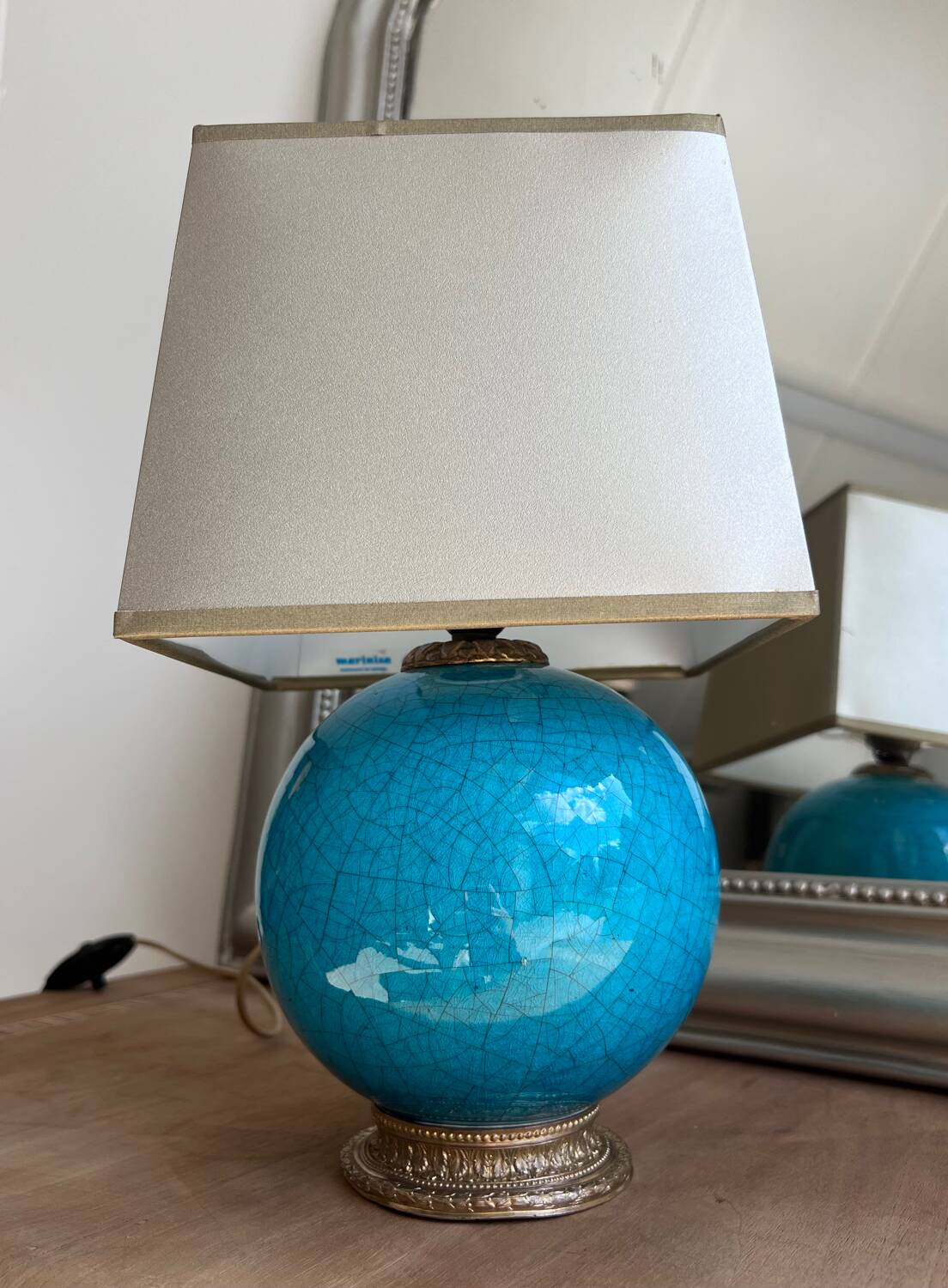 Elegant turquoise crackled ceramic ball lamp, on a br base