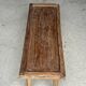 Brown Indonesian teak coffee table, with a border and cylindrical legs H40 L103.