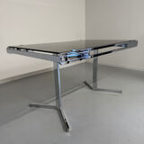 Smoked glass dining table with chrome legs, 1970s design by Roche Bobois.