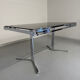 Smoked glass dining table with chrome legs, 1970s design by Roche Bobois.