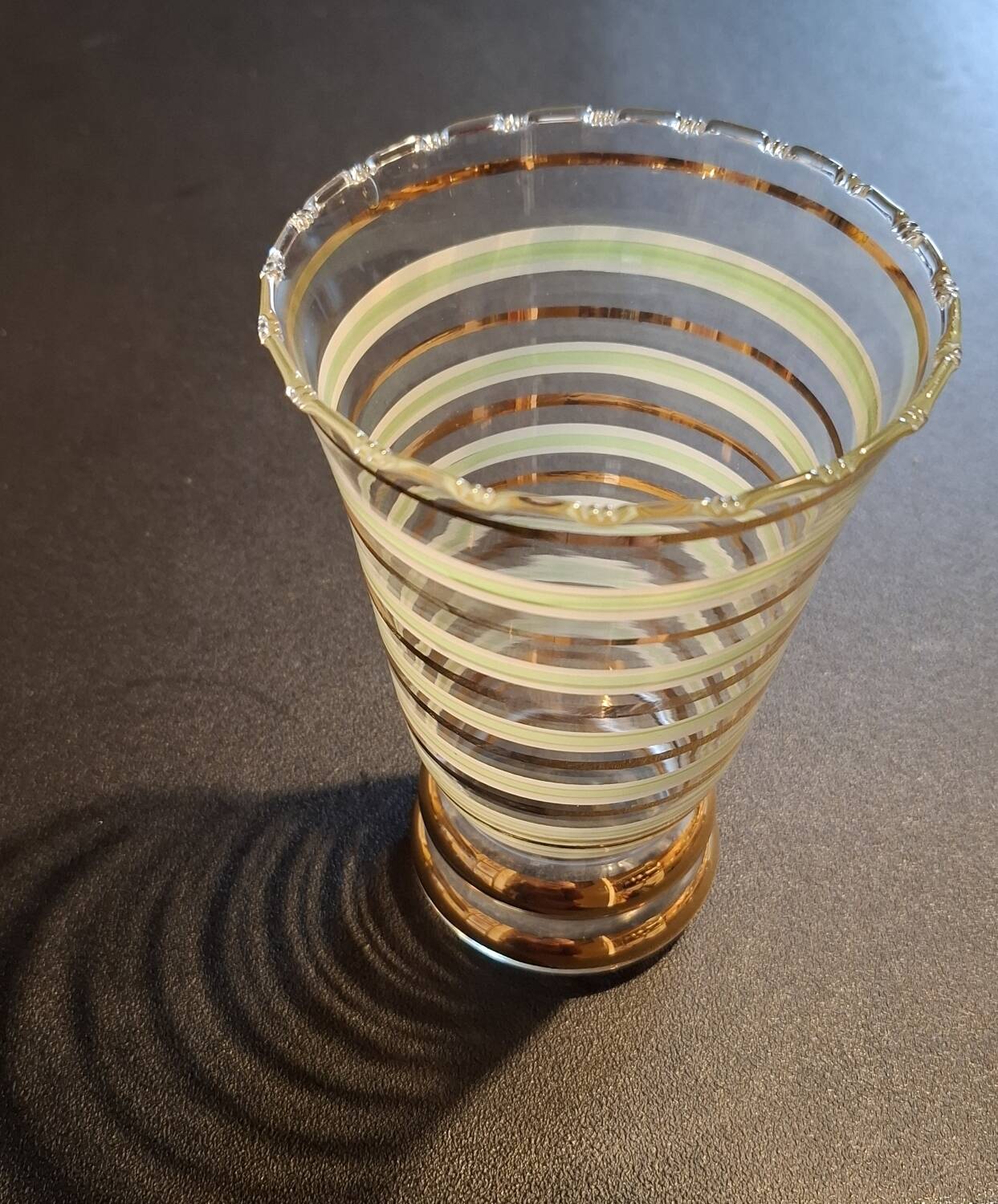 Vintage vase with green and gold trim.