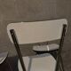 3 white Formica chairs