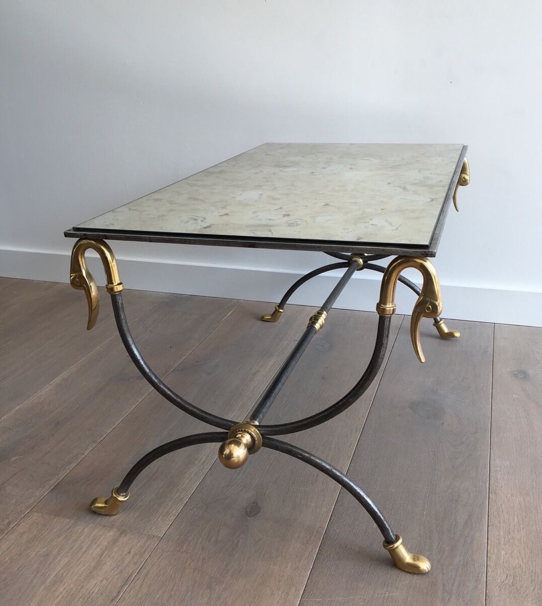 Coffee table in brushed steel and brass