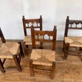 Series of 4 brutalist rustic chairs in carved wood straw seat