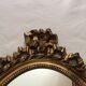 Miroir ovale en bois doré 52 x 35 cm