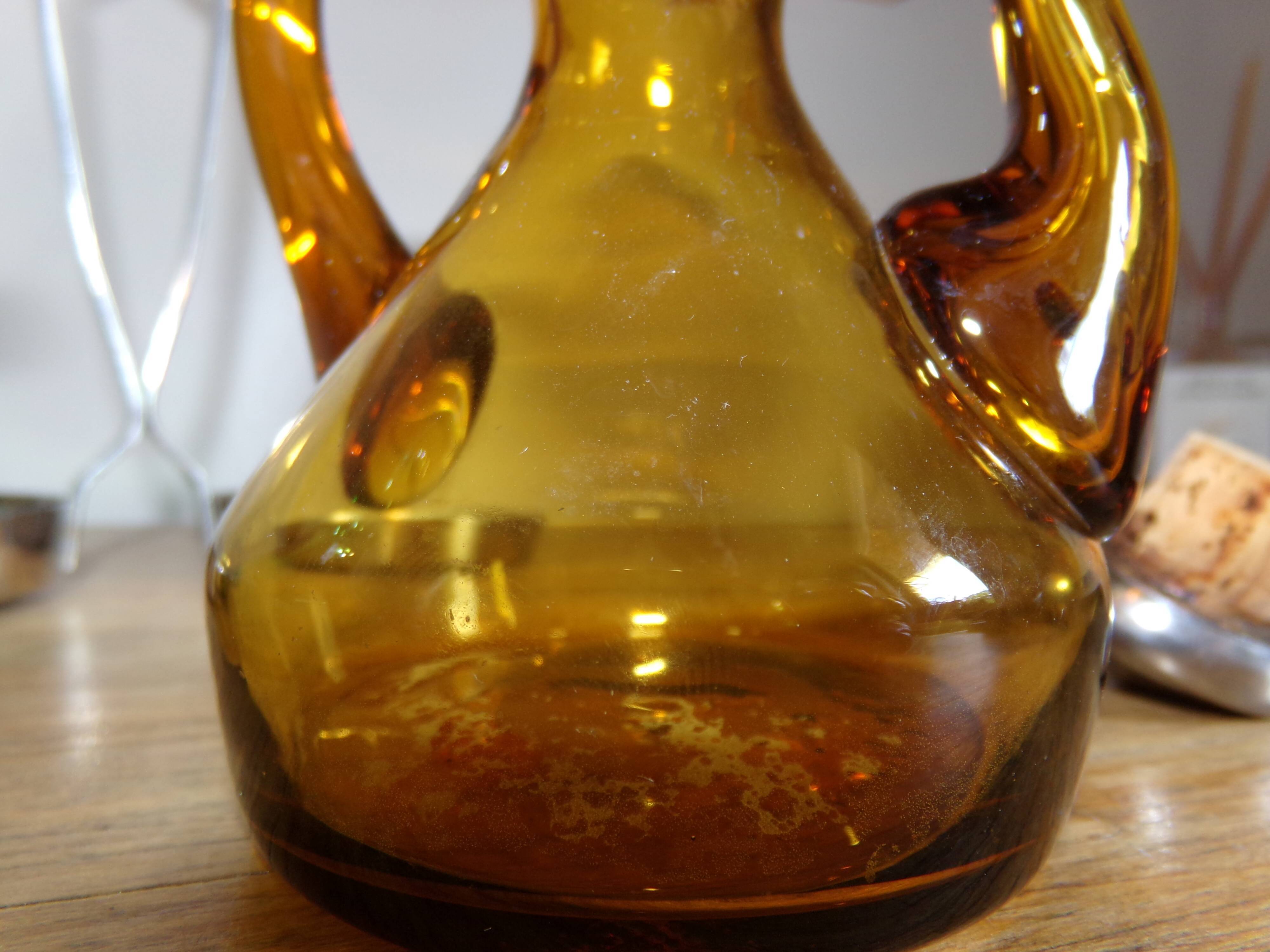 Oil and winery in amber and green sulphur glass