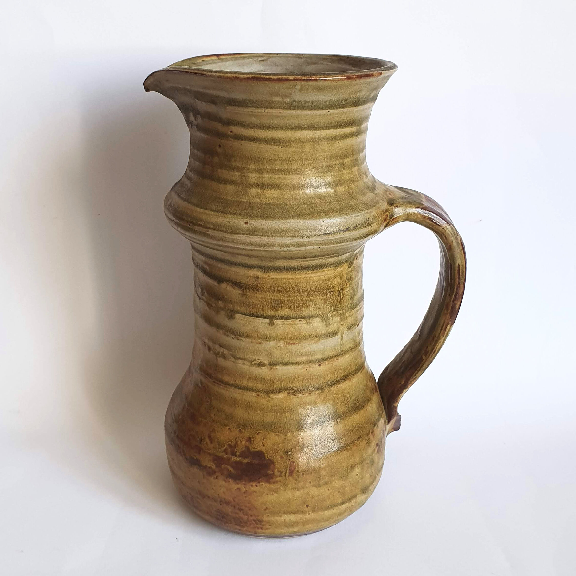 Enamelled sandstone pitcher signed