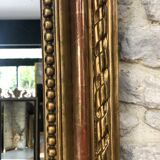 Old mirror 139cm/ 91cm Louis-Philippe with pediment period early 19th, presence of gold leaf.