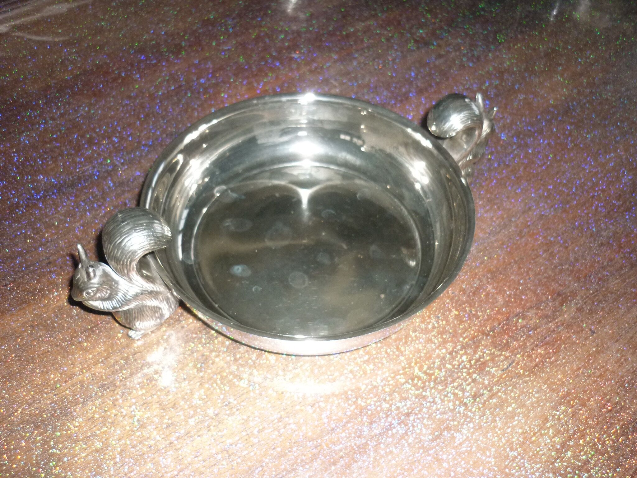 Silver metal dish with squirrels