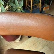 Brown folding chair in vinyl and steel