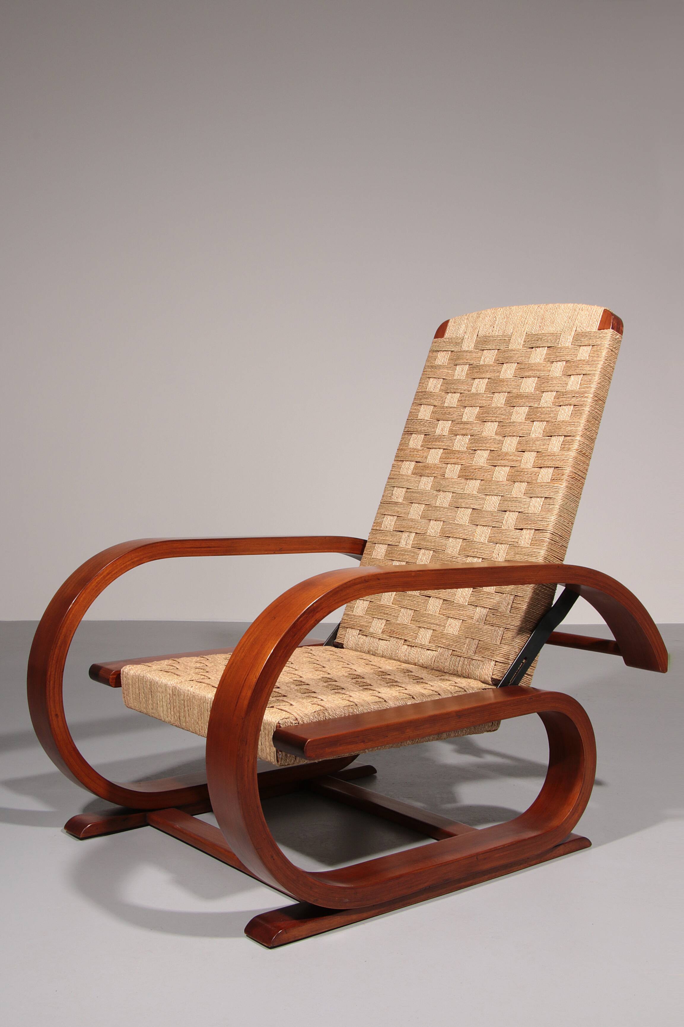 An exceptionally rare mahogany recliner crafted in Italy during the 1950s"