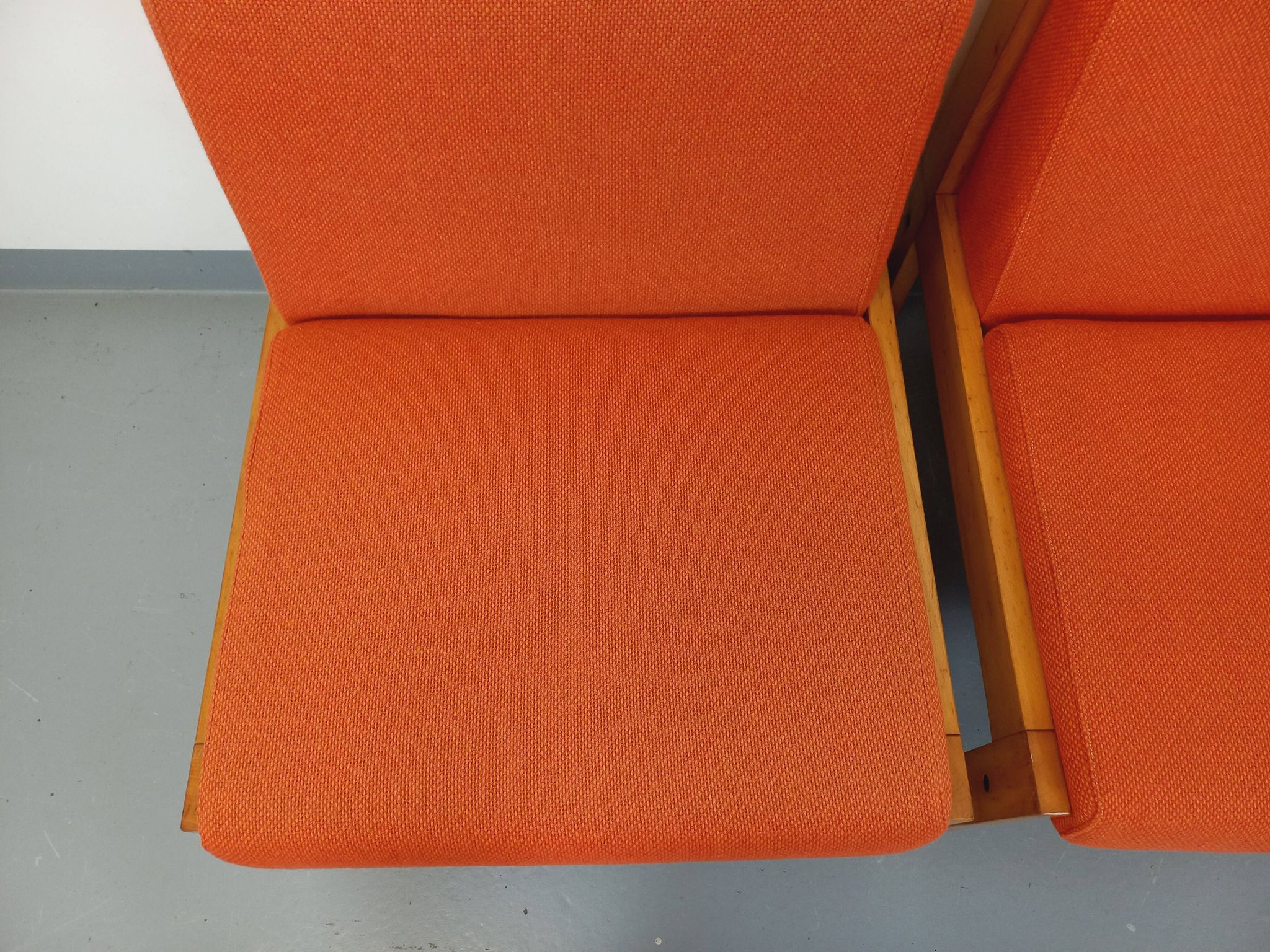 Set of 2 vintage Baumann armchairs in orange fabric and wood from the 80s
