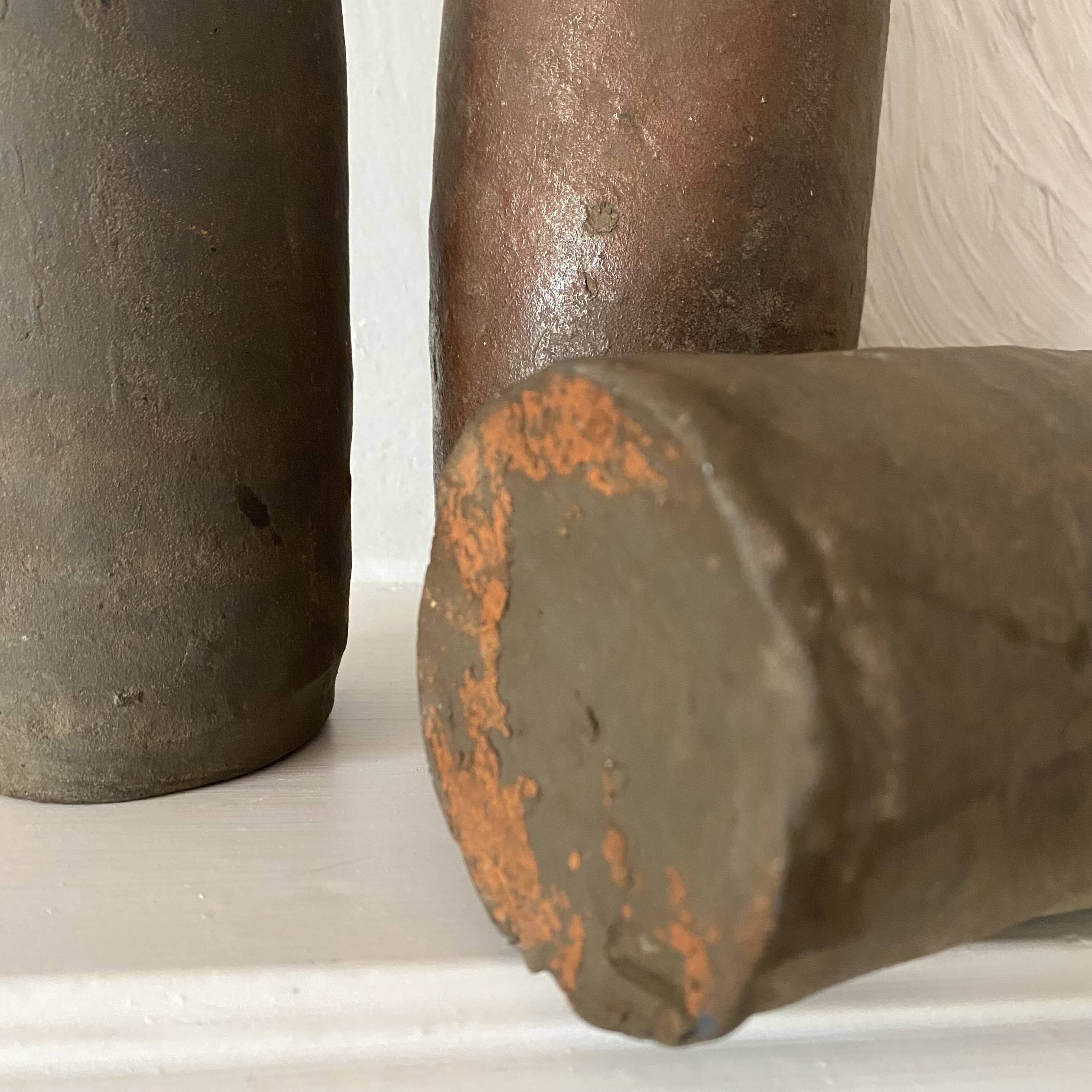 Antique terracotta cider bottles