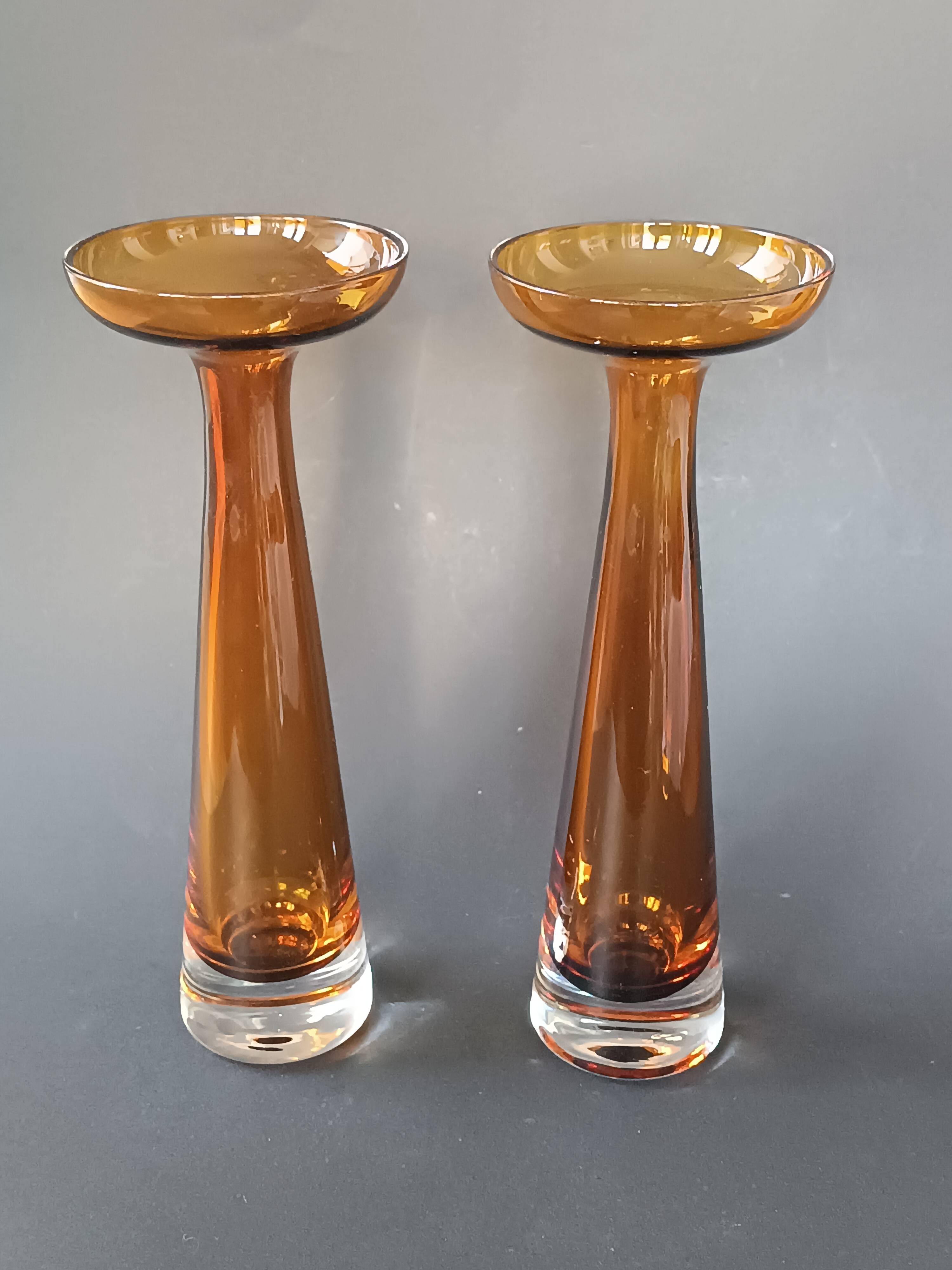 Two vintage Scandinavian double-layered amber blown glass candlesticks