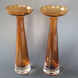 Two vintage Scandinavian double-layered amber blown glass candlesticks