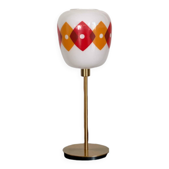 Table lamp with a vintage orange and red "Jacquard" globe in white glass and a golden base