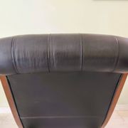 Black leather rocking Chesterfield armchair